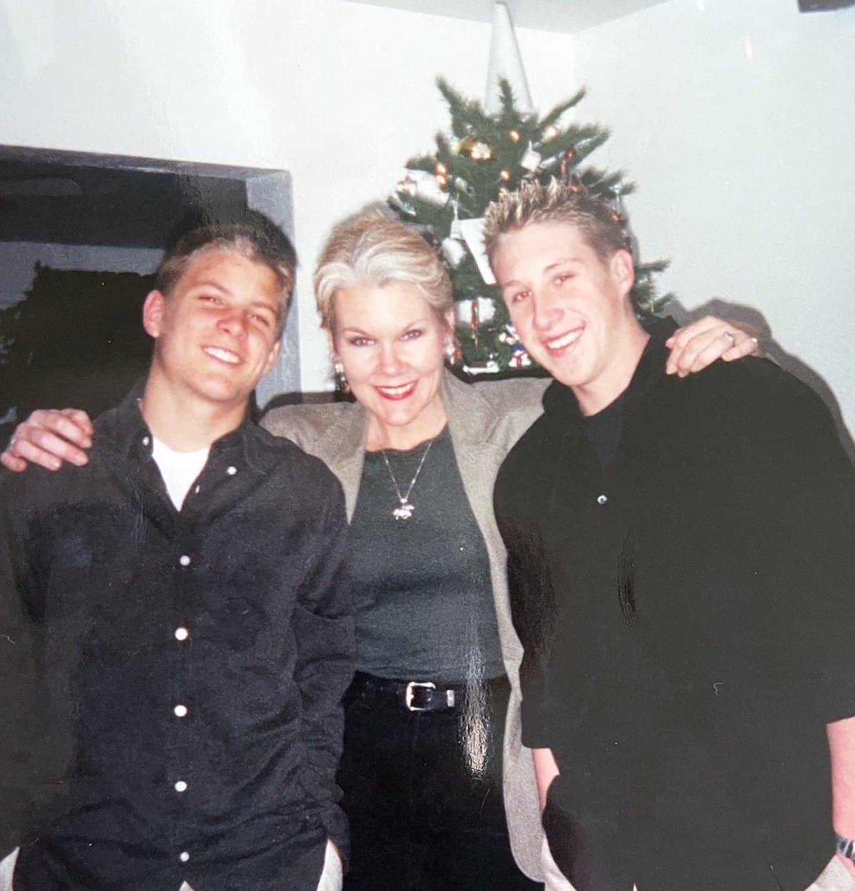 Eve Hess at Christmas with her arms around her two sons, Isaac and Garrett