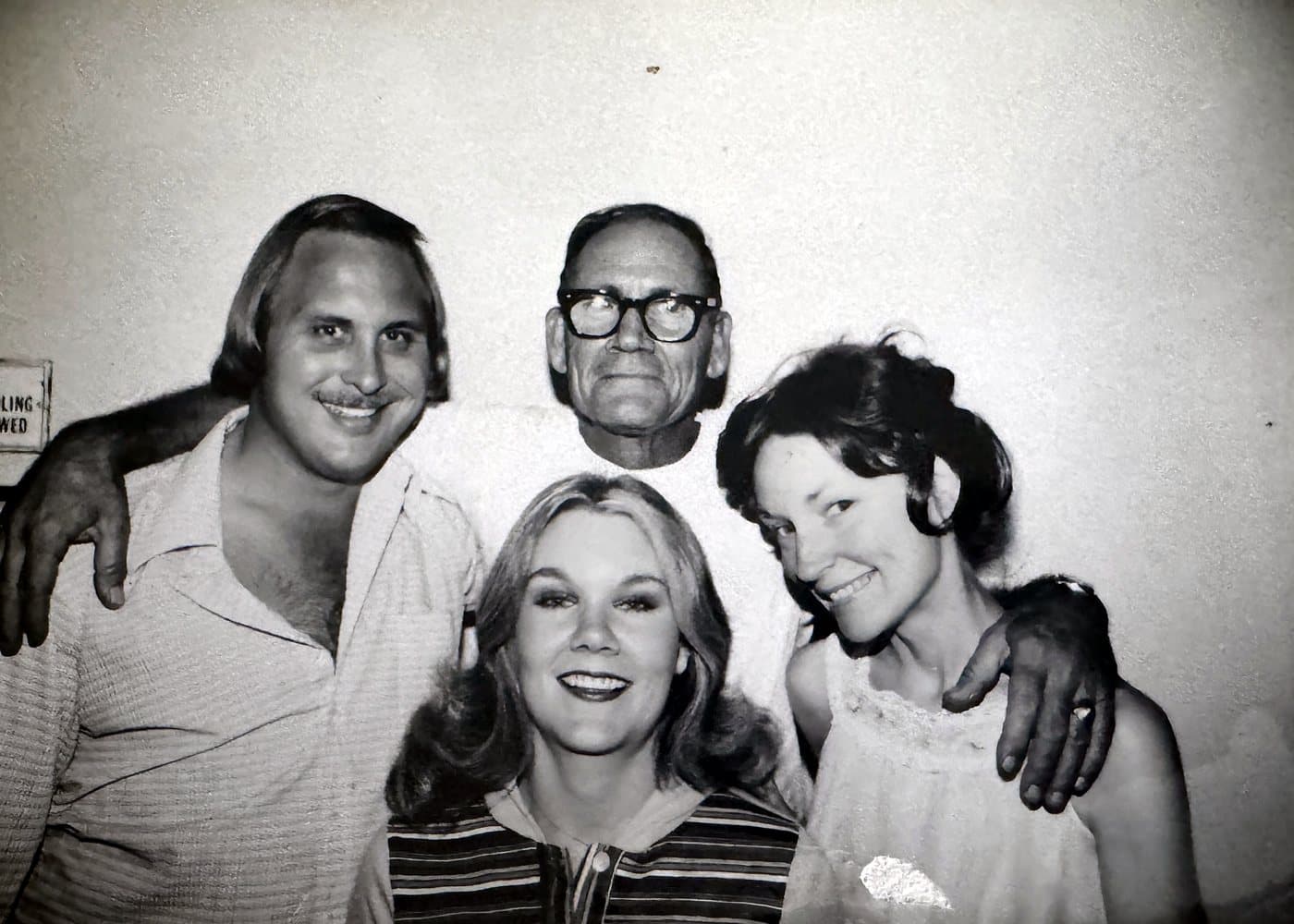 Black-and-white photo of Eve Hess with Rod Hess, her father Joe Winters in glasses, and her sister Sheila