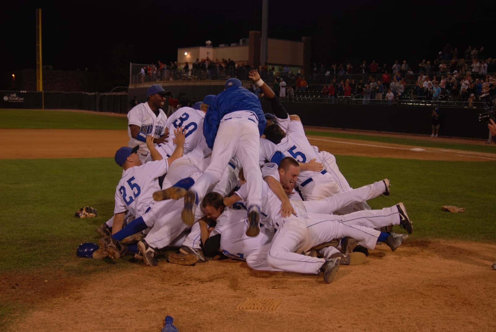 The Windy City ThunderBolts pile on the mound after the 2007 Frontier League championship
